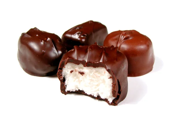Cioccolatini su bianco, un morso — Foto Stock