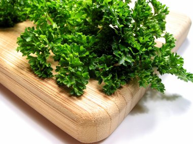 Fresh parsley on cutting board 1 clipart