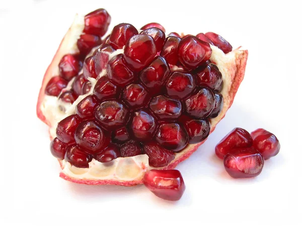 Pomegranate seeds on white — Stock Photo, Image