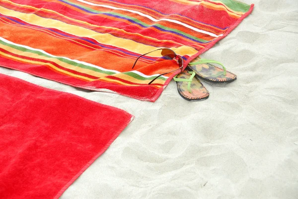 Beach towels on sand — Stok fotoğraf