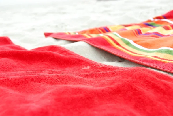 Beach towels on sand — Stock Photo, Image