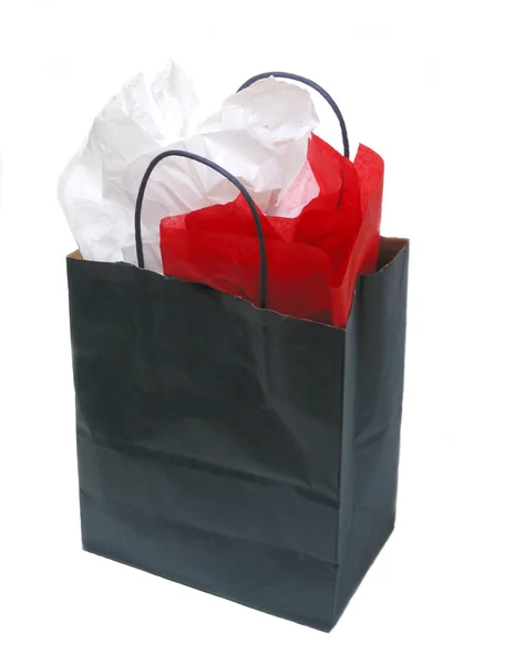 Бумажная сумка с тканями — стоковое фото