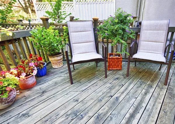 Chairs on wooden deck — Stock Photo, Image