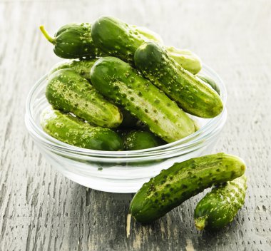 Small cucumbers in bowl clipart