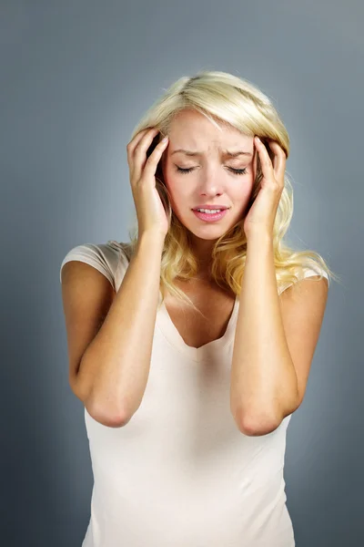 Unhappy woman holding her head — Stock Image Unhappy woman holding her head Royalty Free Stock Images