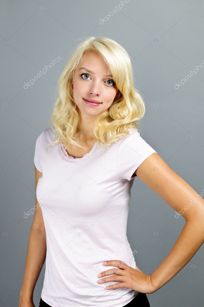 Young blonde woman standing