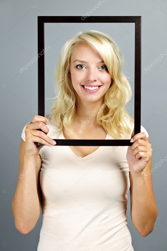Smiling woman with picture frame