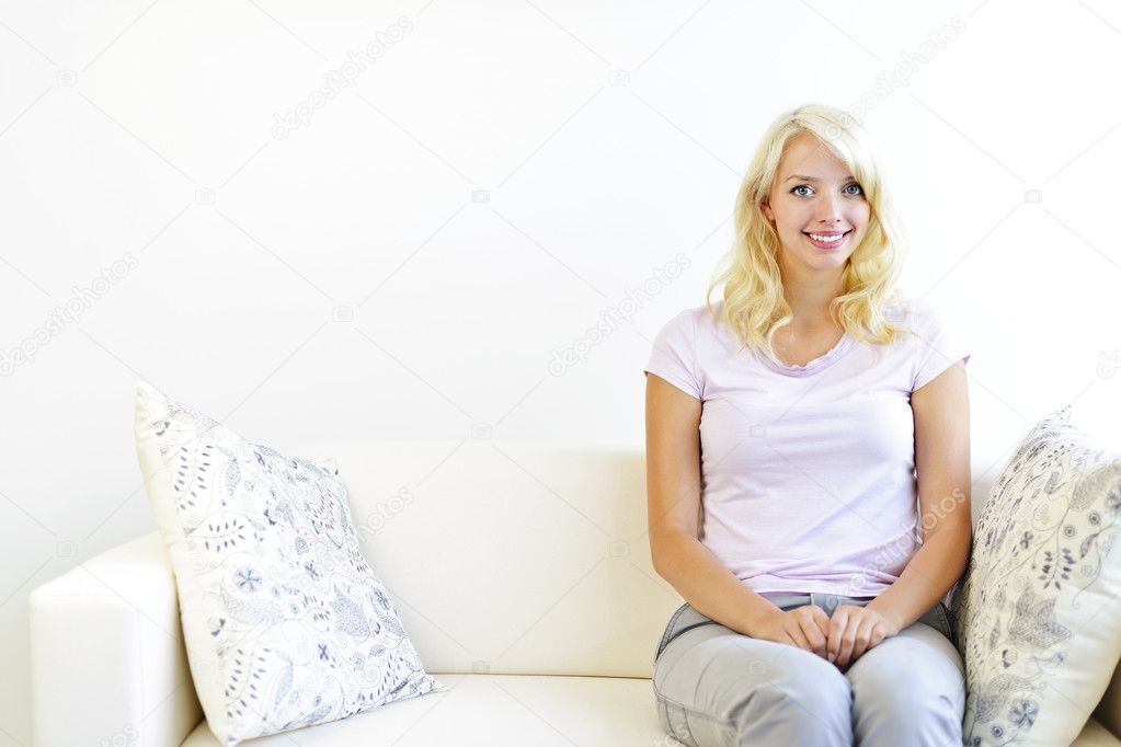 Woman sitting in living room
