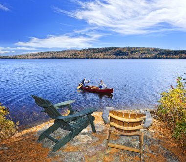 Canoeing on lake clipart