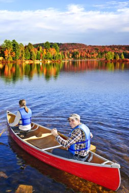 Canoing in fall clipart