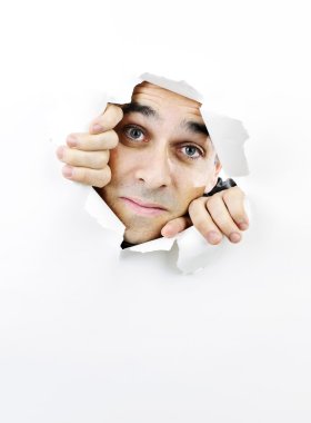 Face looking through hole in paper clipart