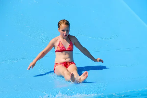 Menina slide de água — Fotografia de Stock