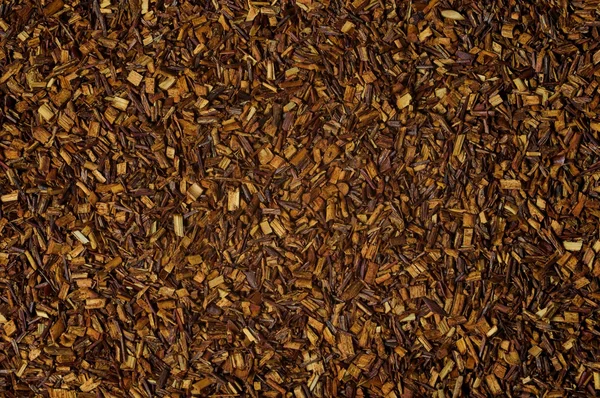 Dry loose Rooibos red tea, texture, background — Stock Photo, Image