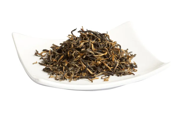 Μαύρο τσάι χαλαρά αποξηραμένα φύλλα τσαγιού, απομονωμένα Εικόνα Αρχείου