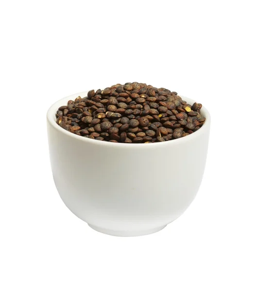 Bowl of dry french green puy lentils, isolated — Stock Photo, Image