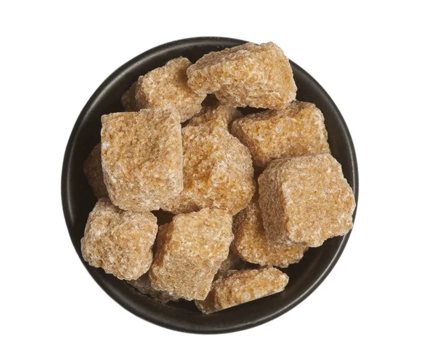 Cubes of cane sugar in bowl, isolated — Stock Photo, Image