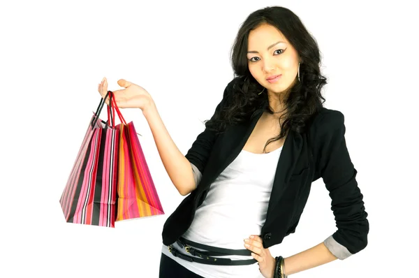 Asiatic young women with gift bags, isolated on white — Stock Photo, Image