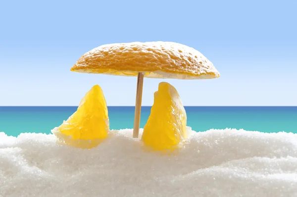 Orange on the sugar beach — Stock Photo, Image