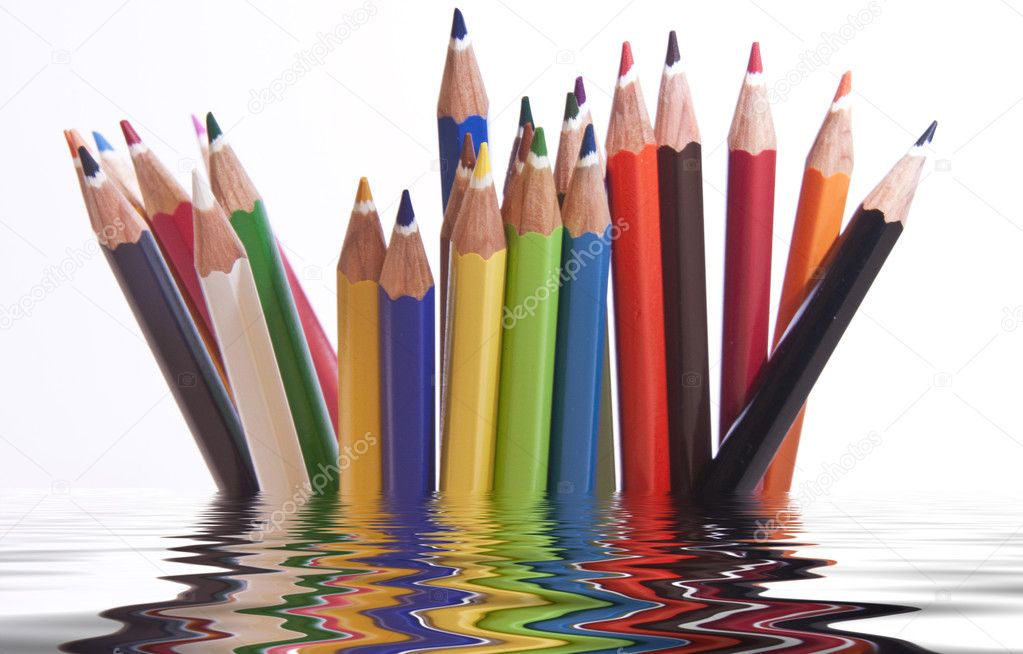 Different coloured pencils with reflection