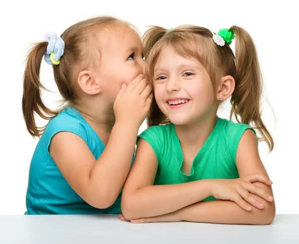 Two little girls are chatting Royalty Free Stock Photos