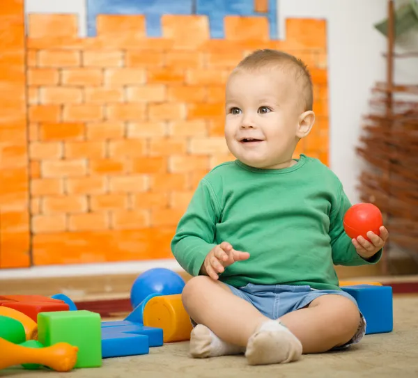 Little boy is playing with toys in preschool — Stock Photo, Image