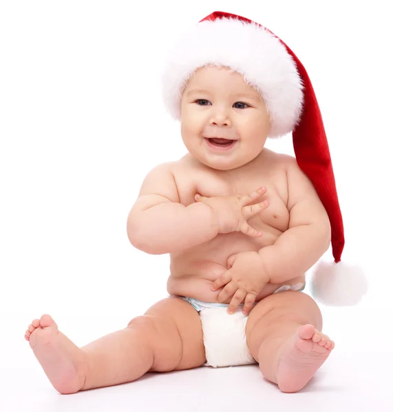 Criança vestindo boné de Natal vermelho — Fotografia de Stock