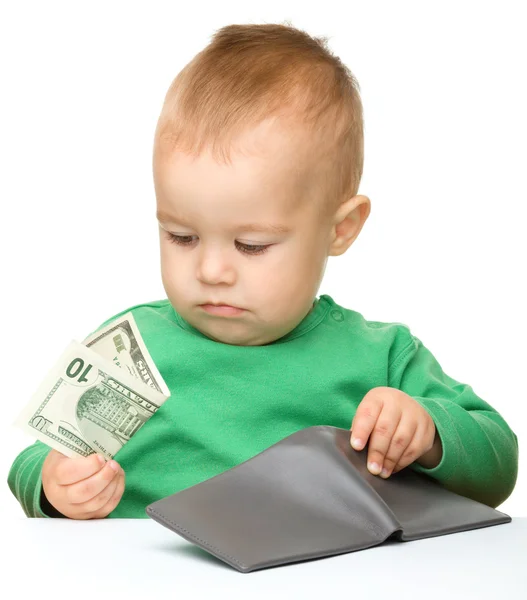 Cute little boy is counting money — Stock Photo, Image