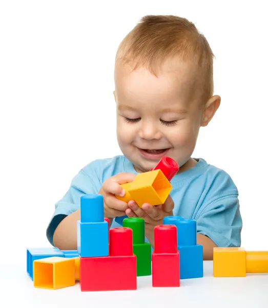 Little boy with building bricks Stock Photo