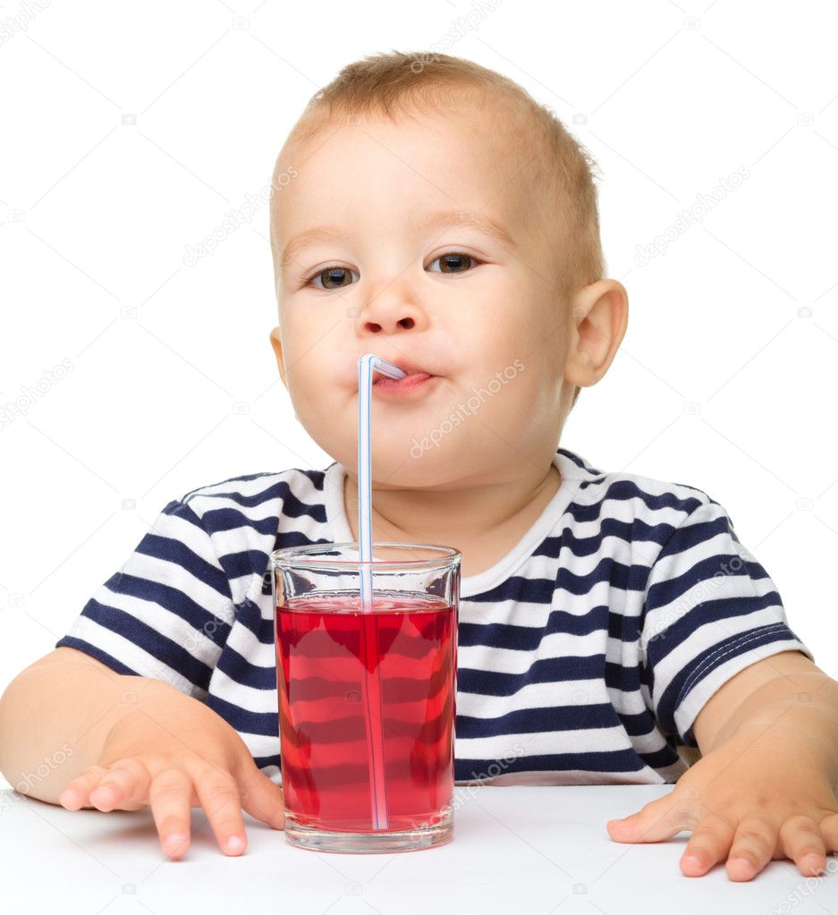 Cute little boy is drinking red juice — Stock Photo © Kobyakov #7336782