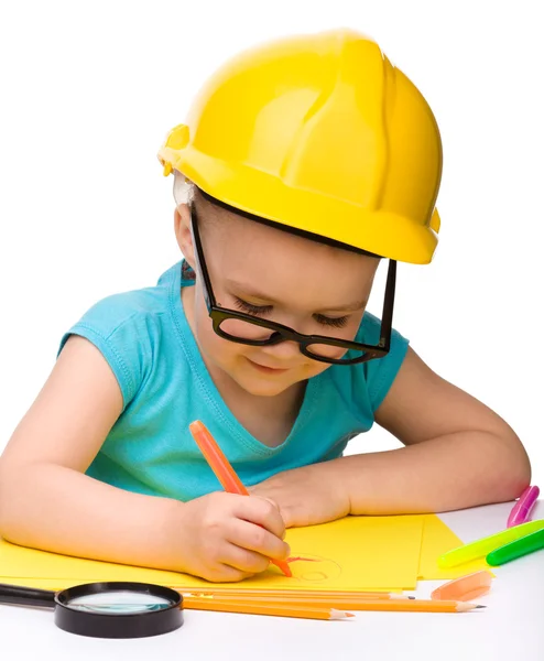 Cute little girl draw with marker wearing hard hat — Stock Photo, Image