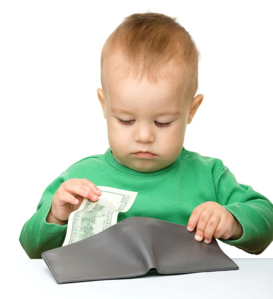 Cute little boy is counting money — Stock Photo, Image