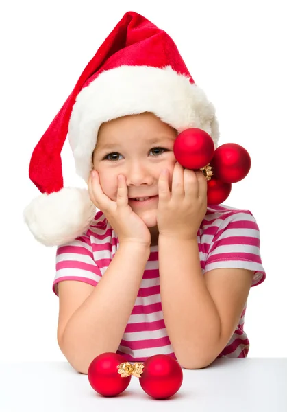 Χαριτωμένο μικρό κορίτσι που φοράει καπέλο santa — Φωτογραφία Αρχείου
