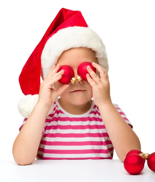 Roztomilá holčička klobouk santa — Stock fotografie