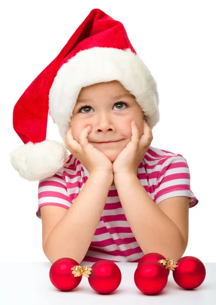 Petite fille mignonne portant un chapeau de Père Noël — Photo