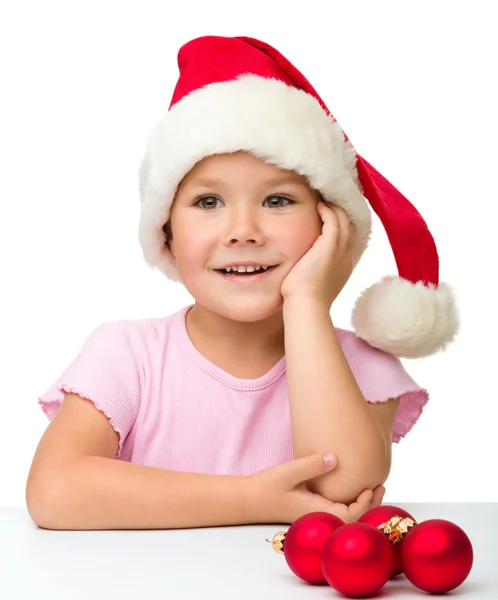 Roztomilá holčička klobouk santa — Stock fotografie