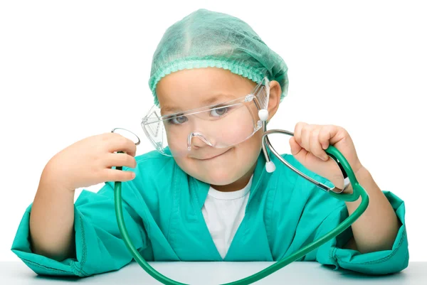 Little girl is playing doctor with stethoscope — Stock Photo, Image