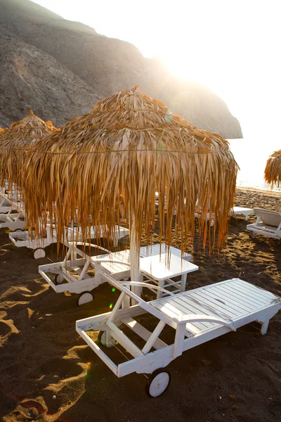 Solsenge i Perissa, Santorini, Grækenland - Stock-foto