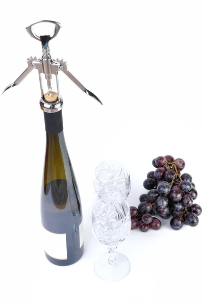 Bottle of wine with aperitive, glasses and grapes isolated in white — Stock Photo, Image