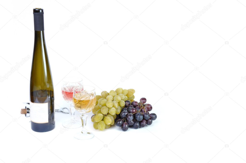 Bottle of wine with aperitive, glasses of wine and grapes isolated in white