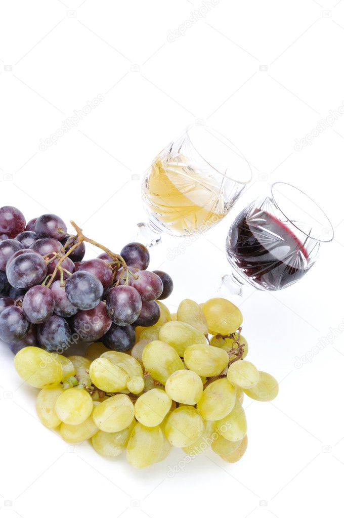 Glasses of wine with grapes isolated in white