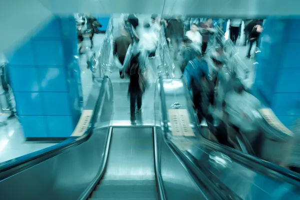 Passenger on moving escalator — Stock Photo, Image