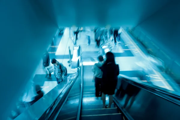 Passenger on moving escalator Royalty Free Stock Photos