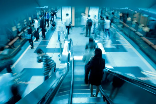 Passenger on moving escalator — Stock Photo, Image