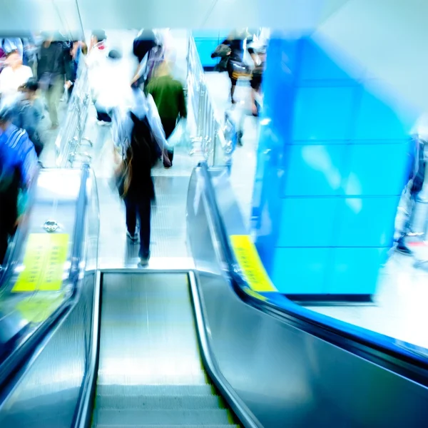 Passenger on moving escalator Royalty Free Stock Images