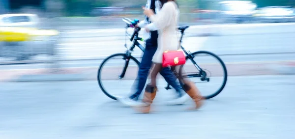 Leisurely boy and girl walk with bicycle — Stock Photo, Image