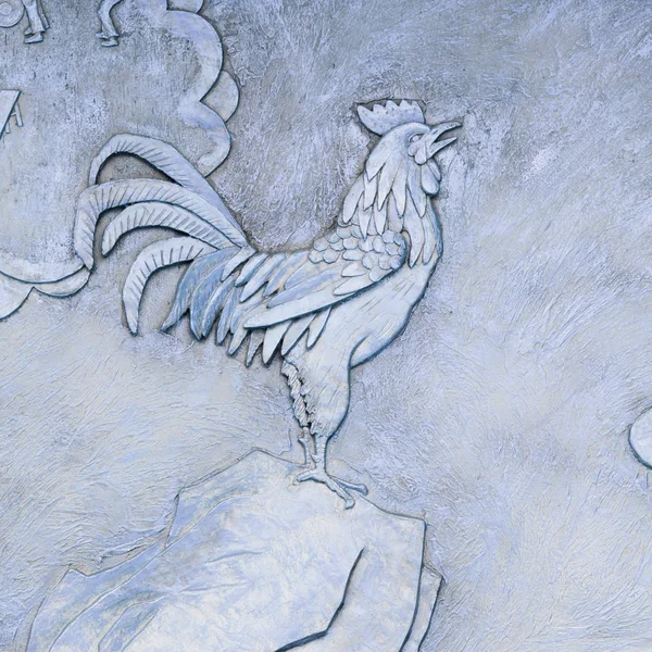 Golden relief of rooster — Stock Photo, Image