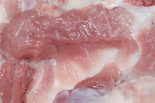 Textura de carne de porco fresca fundo vermelho — Fotografia de Stock