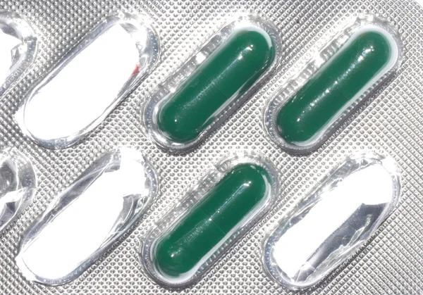 Green capsule pill — Stock Photo, Image