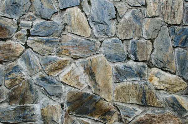 Muur gemaakt van stenen achtergrond — Stockfoto