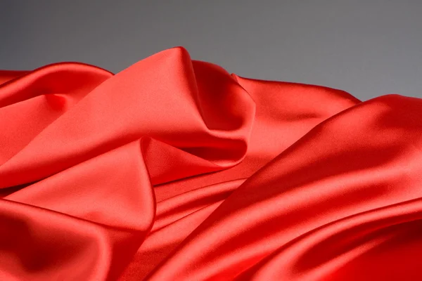 stock image Bright red fabric waves